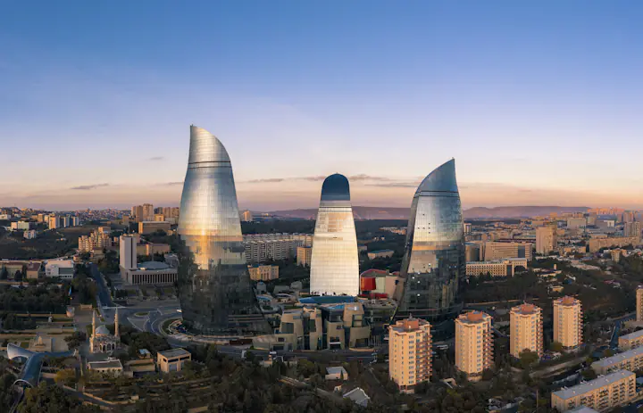 Baku city skyline with the Flame Towers rising above the surrounding buildings.