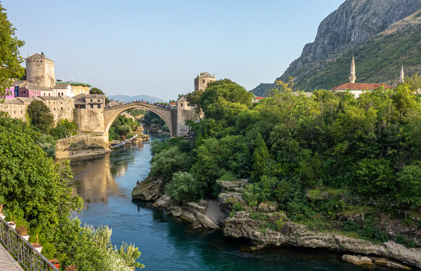 Stari Most crossing the Neretva River between stone towers in Mostar