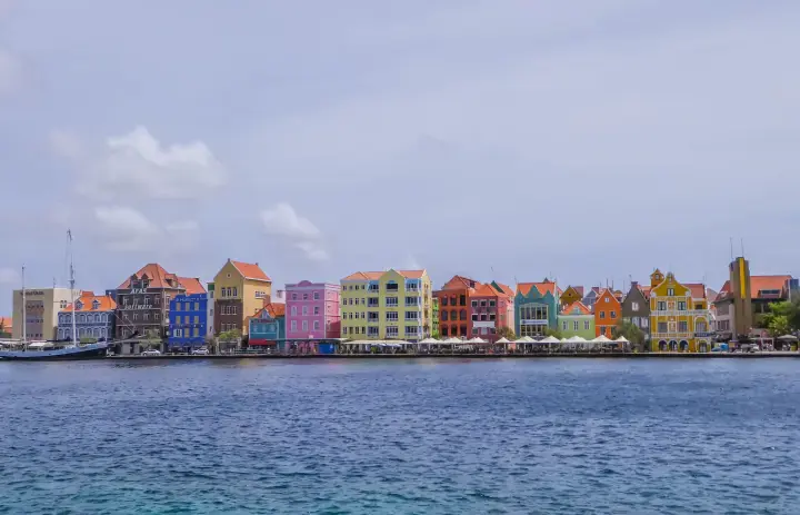 Colourful Handelskade waterfront buildings across the water in Willemstad, Curaçao