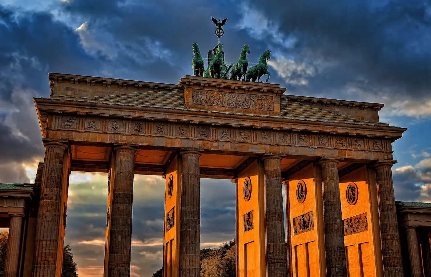 Brandenburg Gate in Berlin beneath a colourful evening sky