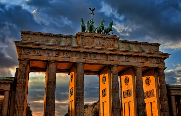 Brandenburg Gate in Berlin beneath a colourful evening sky