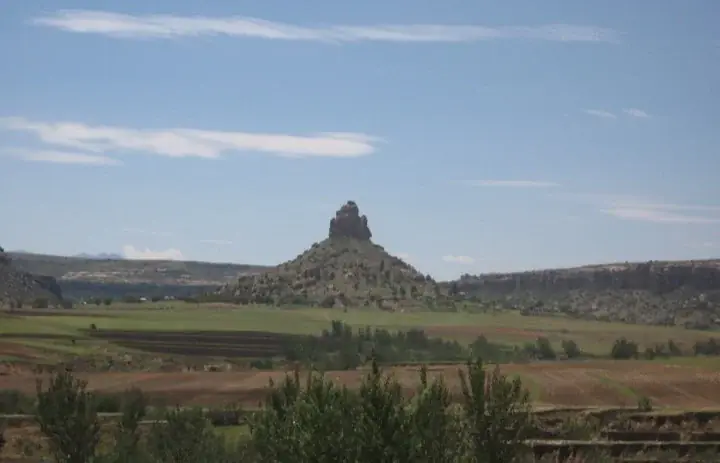 The rocky pinnacle of Qiloane and surrounding farmland near Thaba Bosiu in Lesotho