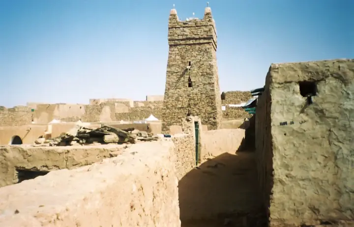 Stone minaret of Chinguetti Mosque above the old town walls in Mauritania