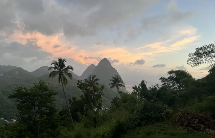 The volcanic Pitons above forest and coastline near Soufrière, Saint Lucia