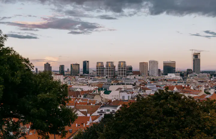 Red rooftops and the modern skyline of Bratislava viewed from the castle hill in Slovakia