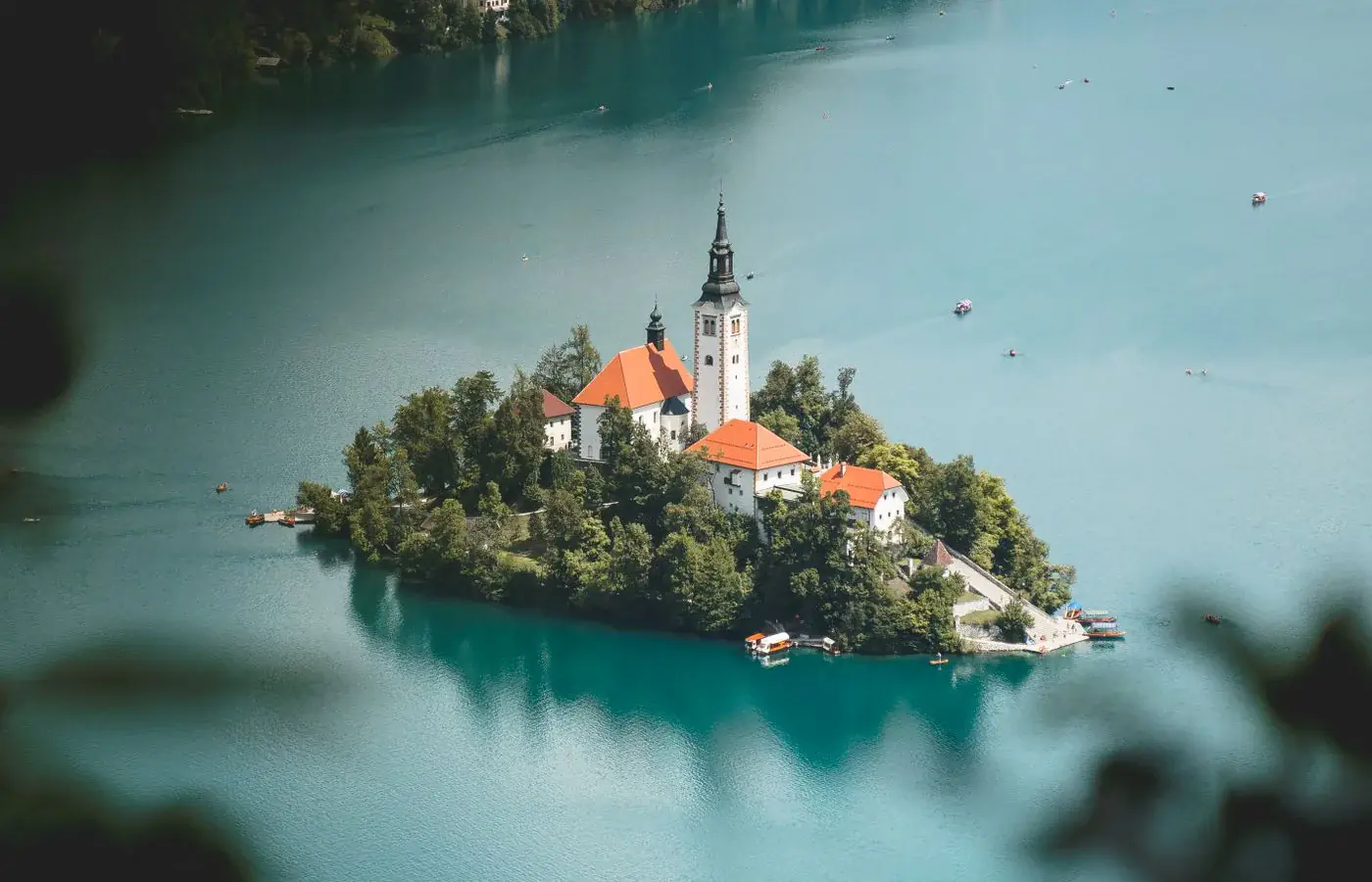 The island church and wooded shores of Lake Bled in Slovenia
